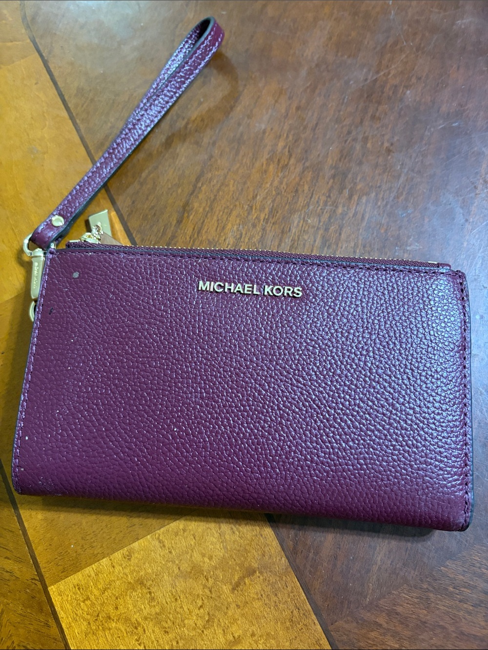 Michael Kors Pebbled Leather Wristlet in Plum